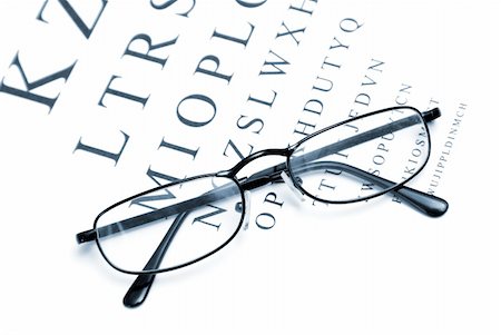 eye doctor test - An eye chart with a pair of glasses to emphasize vision correction. Stock Photo - Budget Royalty-Free & Subscription, Code: 400-04900248