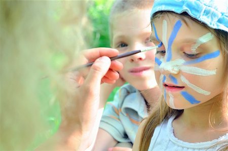 draw carnival animals - outdoor portrait of a child with his face being painted Stock Photo - Budget Royalty-Free & Subscription, Code: 400-04900253