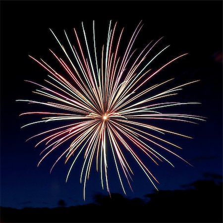 simsearch:400-06477770,k - A firework display explodes into a colorful starburst. Photographie de stock - Aubaine LD & Abonnement, Code: 400-04900485