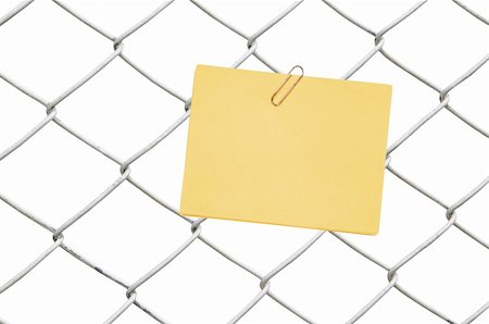 yellow note on chain link fence Stock Photo - Budget Royalty-Free & Subscription, Code: 400-04900557