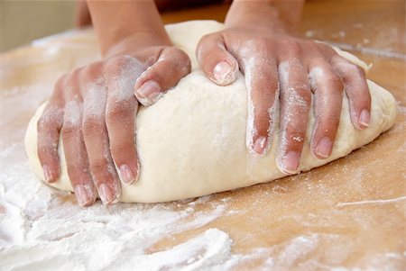 female hands in flour closeup kneading dough on table Stock Photo - Budget Royalty-Free & Subscription, Code: 400-04900620