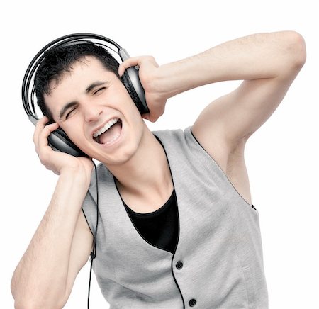 Teenager listening music on headphones isolated on white background:NOTE:Grain was added.Strong contrast photography Stock Photo - Budget Royalty-Free & Subscription, Code: 400-04900766