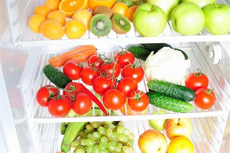 Fruit and vegetables on the shelf of the fridge Stock Photo - Budget Royalty-Free & Subscription, Code: 400-04901255