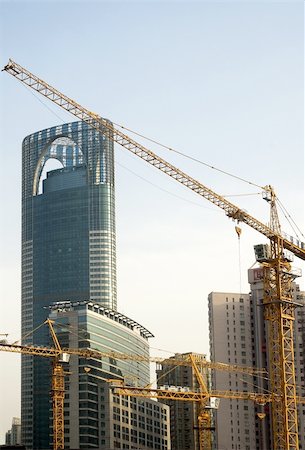simsearch:400-05074551,k - shanghai construction crane over modern building background Foto de stock - Royalty-Free Super Valor e Assinatura, Número: 400-04901640