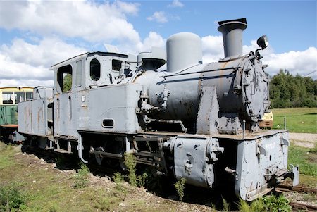 simsearch:400-06100704,k - The steam locomotive of the last century costs at station Fotografie stock - Microstock e Abbonamento, Codice: 400-04902024