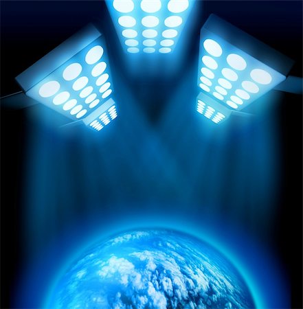 stage floodlight - World premiere lights illuminating blue globe on dark background Stock Photo - Budget Royalty-Free & Subscription, Code: 400-04902682