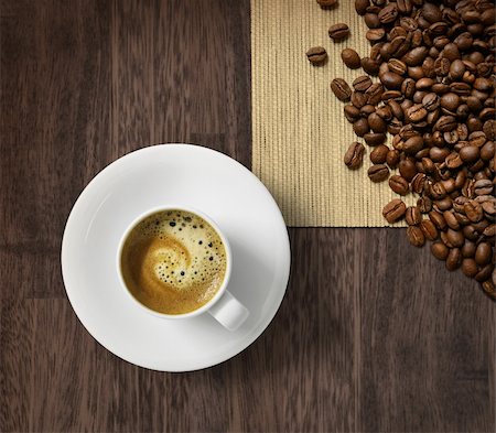 Cup of fresh espresso and roasted coffee beans on dark wooden background Stock Photo - Budget Royalty-Free & Subscription, Code: 400-04902725