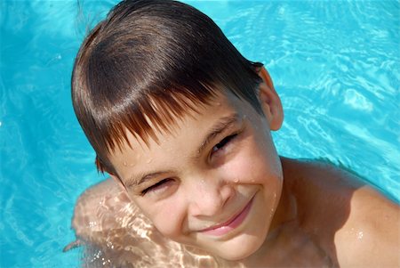 pools interior exterior - happy teen boy in blue swimming pool portrait Stock Photo - Budget Royalty-Free & Subscription, Code: 400-04902754