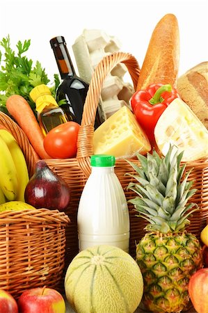 pineapple consumer - Groceries in wicker basket isolated on white Stock Photo - Budget Royalty-Free & Subscription, Code: 400-04902802