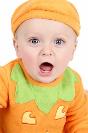 Baby dressed in a pumpkin costume on white background Stock Photo - Budget Royalty-Free & Subscription, Code: 400-04902823