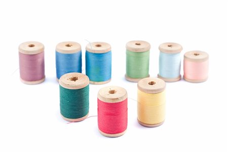 sewing needle fashion - Spools of different colors thread isolated on white background Stock Photo - Budget Royalty-Free & Subscription, Code: 400-04902988