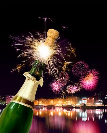 popping champagne cork - Champagne bottle cork popping with sparkling New Year fireworks Stock Photo - Budget Royalty-Free & Subscription, Code: 400-04903152