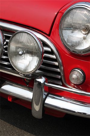 simsearch:400-03943103,k - Chromed grille , bumper and twin headlamps of classic red rally car Photographie de stock - Aubaine LD & Abonnement, Code: 400-04903198