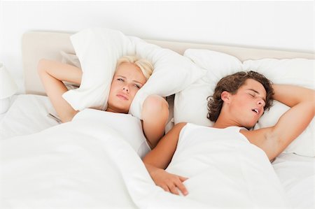 Young couple waking up in their bedroom Stock Photo - Budget Royalty-Free & Subscription, Code: 400-04903636