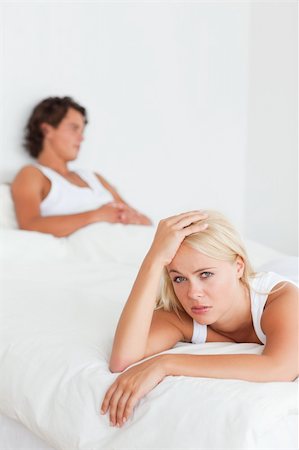 simsearch:400-06172922,k - Portrait of an upset couple on their bed Stock Photo - Budget Royalty-Free & Subscription, Code: 400-04903863