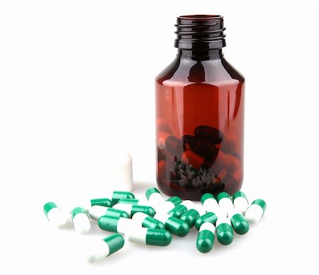 Pills from bottle on the white Stock Photo - Budget Royalty-Free & Subscription, Code: 400-04915055