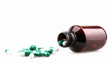 Pills from bottle on the white Stock Photo - Budget Royalty-Free & Subscription, Code: 400-04915052