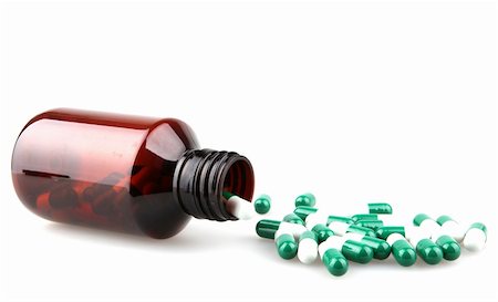 Pills from bottle on the white Fotografie stock - Microstock e Abbonamento, Codice: 400-04915053