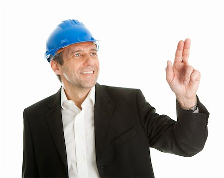 Portrait of successful architect pointing. Focus on fingers. Isolated on white Fotografie stock - Microstock e Abbonamento, Codice: 400-04915378