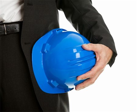 engineer background - Close-up of architect/worker holding blue hard hat. Isolated on white Stock Photo - Budget Royalty-Free & Subscription, Code: 400-04915419