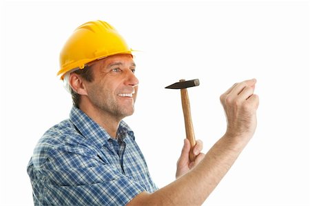 simsearch:400-05341942,k - Confident worker wearing hard hat and hammering in. Isolated on white Stock Photo - Budget Royalty-Free & Subscription, Code: 400-04915427