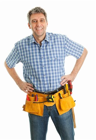 Confident worker wearing toolbelt. Isolated on white Fotografie stock - Microstock e Abbonamento, Codice: 400-04915433