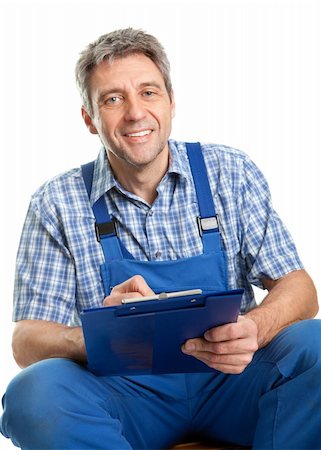 Confident service man taking notes. Isolated on white Stock Photo - Budget Royalty-Free & Subscription, Code: 400-04915453