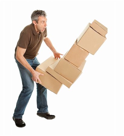 Delivery man with falling stack of boxes. Isolated on white Stock Photo - Budget Royalty-Free & Subscription, Code: 400-04915466