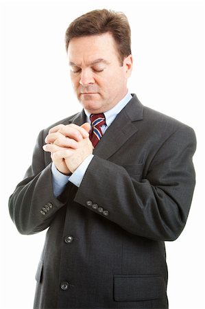 simsearch:400-05347520,k - Businessman or minister with hands folded in prayer.  Isolated on white. Photographie de stock - Aubaine LD & Abonnement, Code: 400-04915680