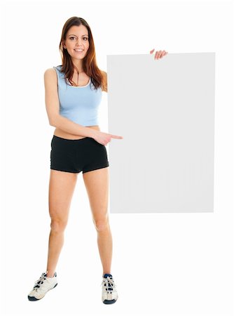 Fitness woman presenting empty placard. Isolated on white Fotografie stock - Microstock e Abbonamento, Codice: 400-04915804