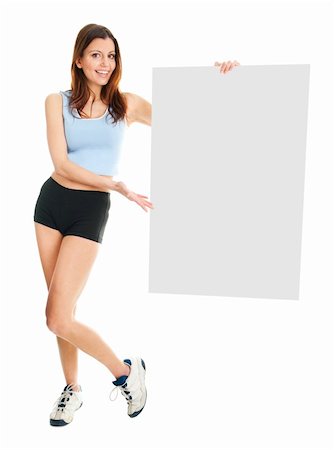 Fitness woman presenting empty placard. Isolated on white Fotografie stock - Microstock e Abbonamento, Codice: 400-04915806