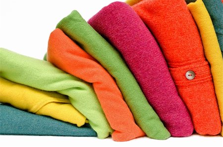 Stack of women's sweaters and cardigans in bright vivid colours against white. Stock Photo - Budget Royalty-Free & Subscription, Code: 400-04915910