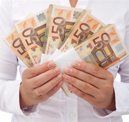 pile hands bussiness - Stack of fifty euro banknotes in woman hands - closeup Stock Photo - Budget Royalty-Free & Subscription, Code: 400-04916199
