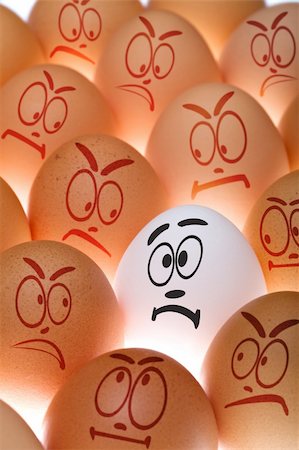 face pack - White egg between angry brown ones Stock Photo - Budget Royalty-Free & Subscription, Code: 400-04916211