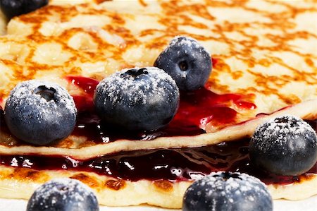 photos of blueberries for kitchen - closeup of sugar covered blueberries with jam on pancakes Stock Photo - Budget Royalty-Free & Subscription, Code: 400-04916905