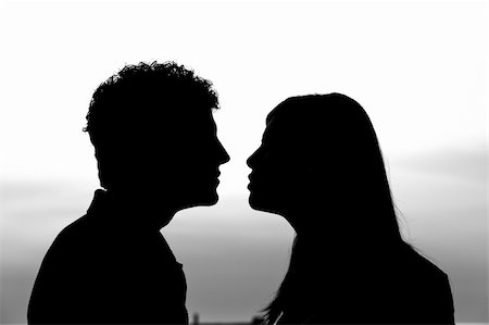 Young Couple Silhouette at Sunset Stock Photo - Budget Royalty-Free & Subscription, Code: 400-04917070