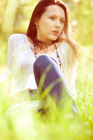 rettich - Thoughtful pretty young girl sitting on green grass Stock Photo - Budget Royalty-Free & Subscription, Code: 400-04917149