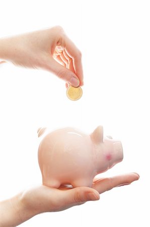 piggy bank hand - piggy bank or piggybank with hand isolated on white background showing savings concept Stock Photo - Budget Royalty-Free & Subscription, Code: 400-04917310