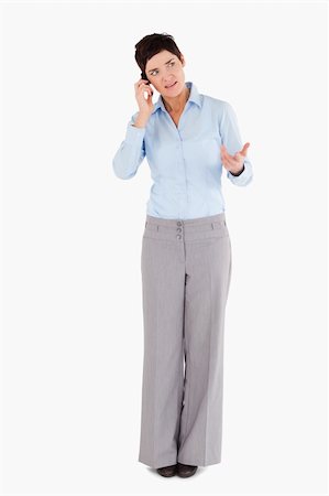 simsearch:400-04845928,k - Unhappy woman making a phone call against a white background Foto de stock - Super Valor sin royalties y Suscripción, Código: 400-04917607