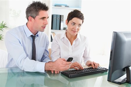 Colleagues working together in an office Stock Photo - Budget Royalty-Free & Subscription, Code: 400-04917756