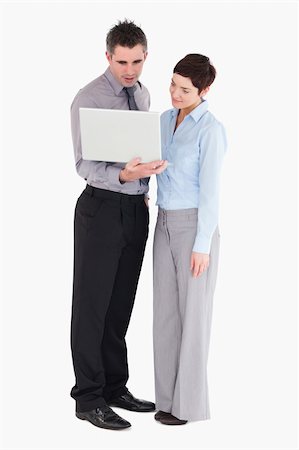 simsearch:400-04918393,k - Coworker using a laptop against a white background Stock Photo - Budget Royalty-Free & Subscription, Code: 400-04917890