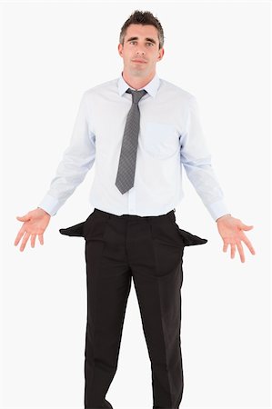 person holding their empty pockets - Portrait of a ruined businessman against a white background Stock Photo - Budget Royalty-Free & Subscription, Code: 400-04918055