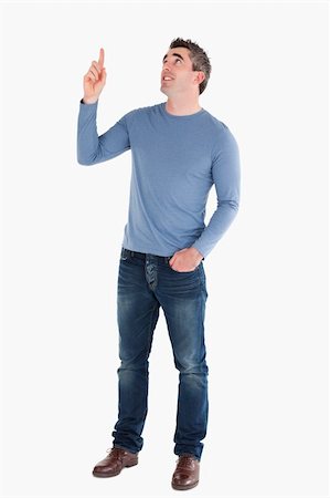 eye pointing - Handsome man pointing at copy space against white background Stock Photo - Budget Royalty-Free & Subscription, Code: 400-04918259