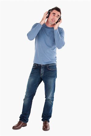 simsearch:400-05717354,k - Man listening to music against a white background Stock Photo - Budget Royalty-Free & Subscription, Code: 400-04918285