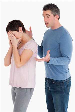 simsearch:400-06172922,k - Wife crying while her husband is trying to explain himself against a white background Stock Photo - Budget Royalty-Free & Subscription, Code: 400-04918335