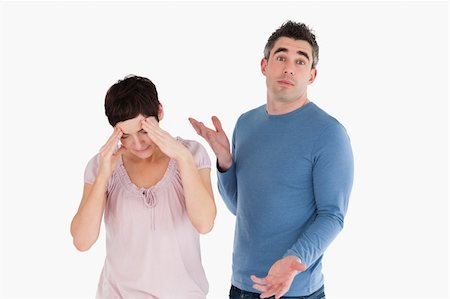simsearch:400-06172922,k - Wife crying while her husband is wondering why against a white background Stock Photo - Budget Royalty-Free & Subscription, Code: 400-04918336