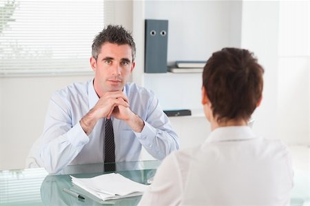 Serious manager interviewing a female applicant in his office Stock Photo - Budget Royalty-Free & Subscription, Code: 400-04918409
