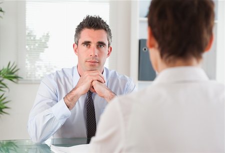 Handsome manager interviewing an applicant in his office Stock Photo - Budget Royalty-Free & Subscription, Code: 400-04918411