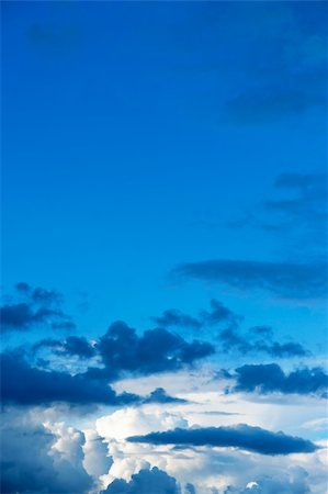 Background of blue sky with fluffy clouds Stock Photo - Budget Royalty-Free & Subscription, Code: 400-04918505