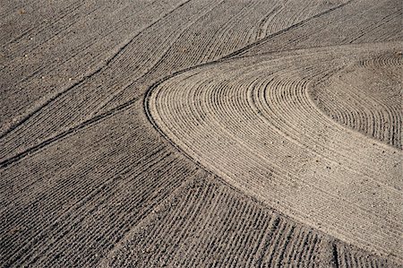 Brown background of plowed field with interesting pattern Stock Photo - Budget Royalty-Free & Subscription, Code: 400-04918601